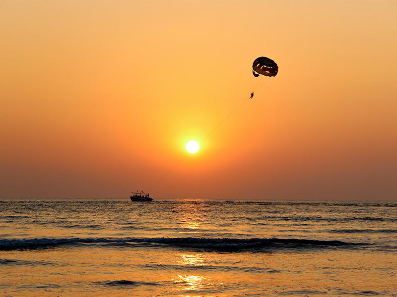 Sunset Shot Of Parasail Boat